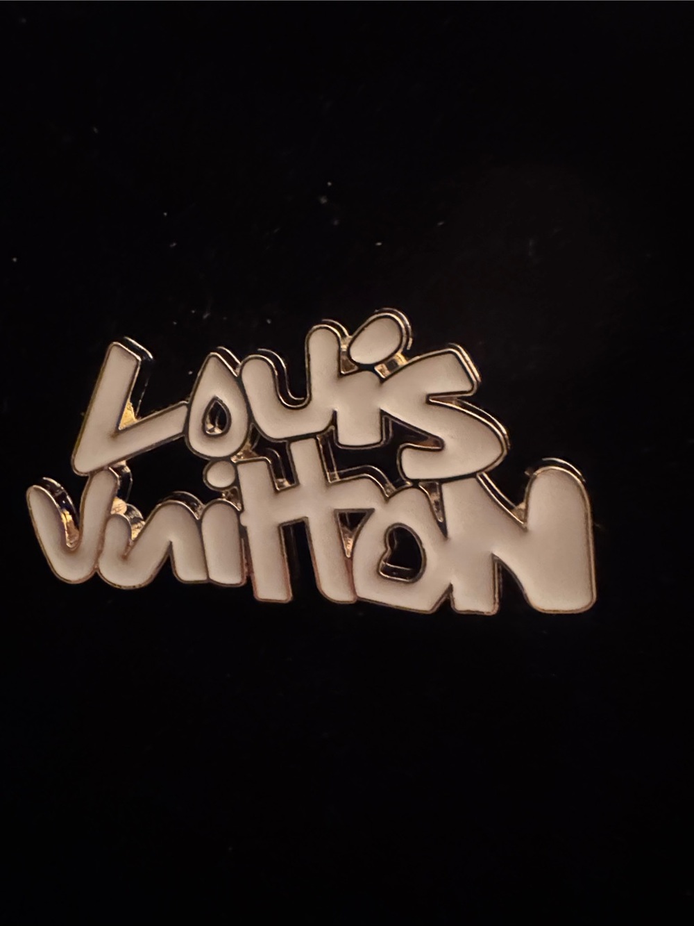 Louis Vuitton Gold Script Logo on Black